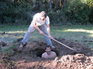 Eduardo burying Aran in the well.jpg